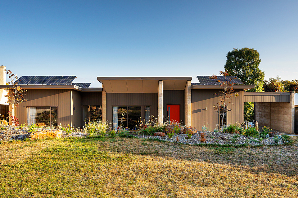 North view of the home, large grassy section with native Australian plants